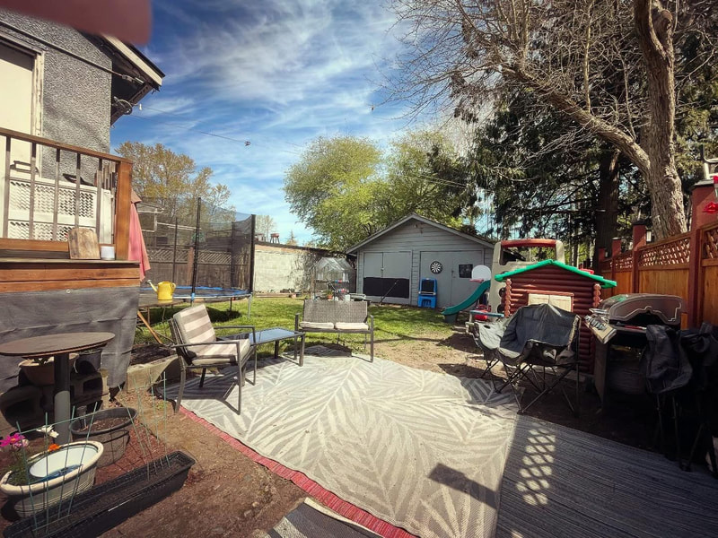 The fenced backyard play space at Nickies Daycare