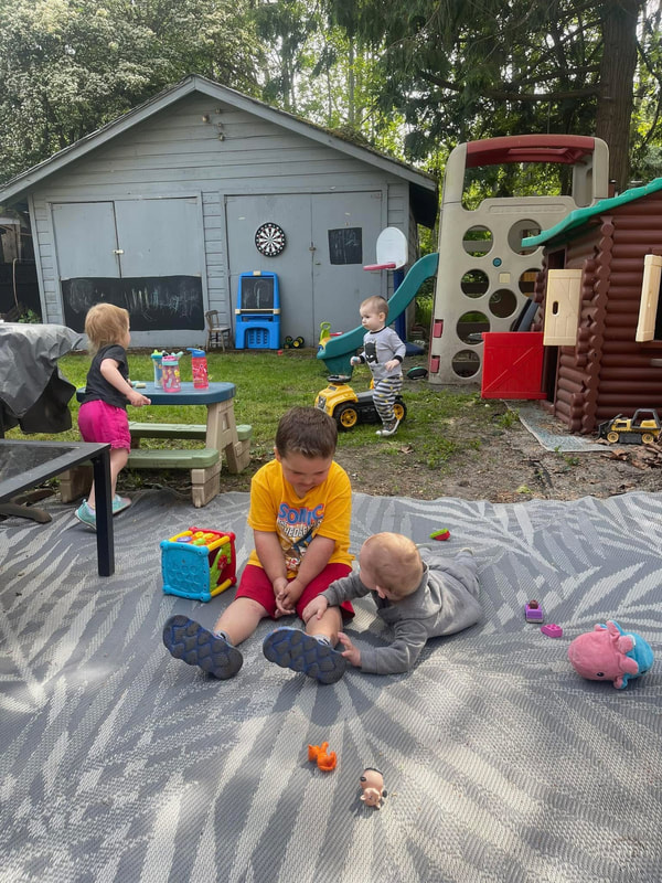 Children playing together in the daycare backyard